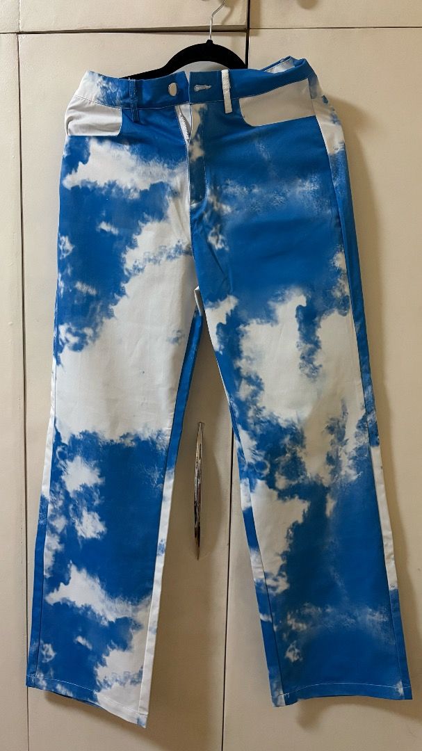 Blue Sky Cloud Print Wide Leg Pants (Category: Other Bottoms) located in Taguig. Submitted by fayneayana (Listing ID 1458817338, Image 1). Description: - Unique blue sky and cloud print - Wide leg style - Estimated size: Medium - Perfect for making a statement - Great for casual wear or a fun, standout outfit.