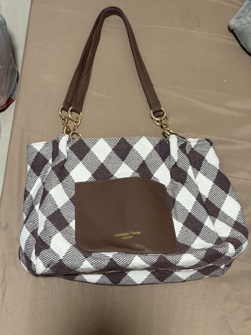 Brown checkered medium shoulder bag (Category: Shoulder Bags) located in Manila. Submitted by warmcat.b45a52 (Listing ID 1458844422, Image 1). Description: Cute brown shoulder bag with minimal signs of usage.