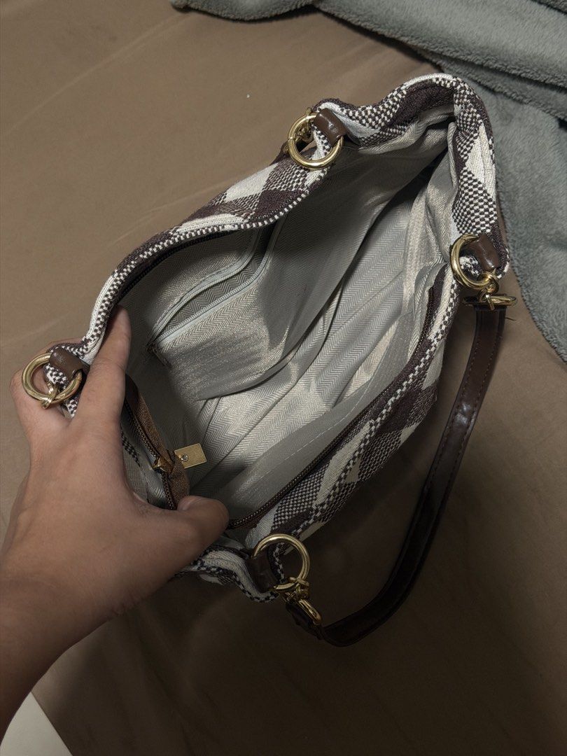 Brown checkered medium shoulder bag (Category: Shoulder Bags) located in Manila. Submitted by warmcat.b45a52 (Listing ID 1458844422, Image 2). Description: Cute brown shoulder bag with minimal signs of usage.