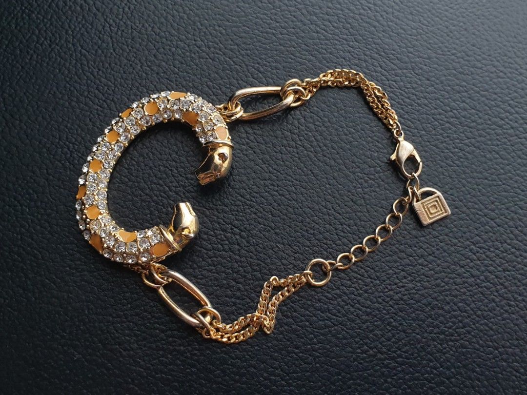 C Shaped Panther Bracelet (Category: Bracelets) located in Quezon City. Submitted by WasalakTwo (Listing ID 1458809215, Image 2). Description: Bought in Japan High quality Goodcondition Still presentable No missing stones Wrist up to 7.3" Open for delivery nationwide.