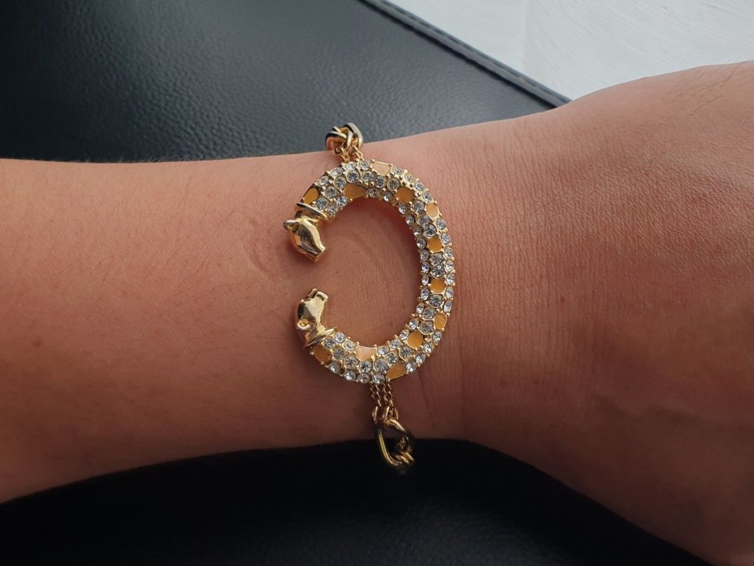 C Shaped Panther Bracelet (Category: Bracelets) located in Quezon City. Submitted by WasalakTwo (Listing ID 1458809215, Image 1). Description: Bought in Japan High quality Goodcondition Still presentable No missing stones Wrist up to 7.3" Open for delivery nationwide.