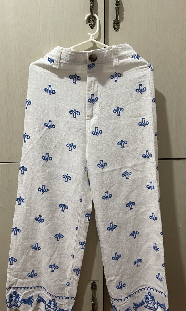 Calliope White Pants with Blue Embroidery (Category: Other Bottoms) located in Cabanatuan. Submitted by lovelyaly (Listing ID 1458781356, Image 1). Description: - White pants with all-over blue embroidery - 24-25 in waist, 36 length.