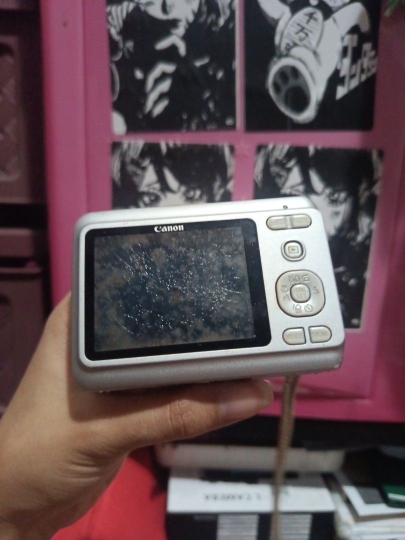 Canon PowerShot with issues (Category: Cameras) located in Muntinlupa City. Submitted by cham_porado15 (Listing ID 1458697226, Image 3). Description: - Silver Canon PowerShot A480 digital camera - Screen has visible scratches - Battery compartment shown open (batteries not included) - Buy at your own risk because all sales are final😭 issue : LCD Crisp MOP: JNT & Lalamove.