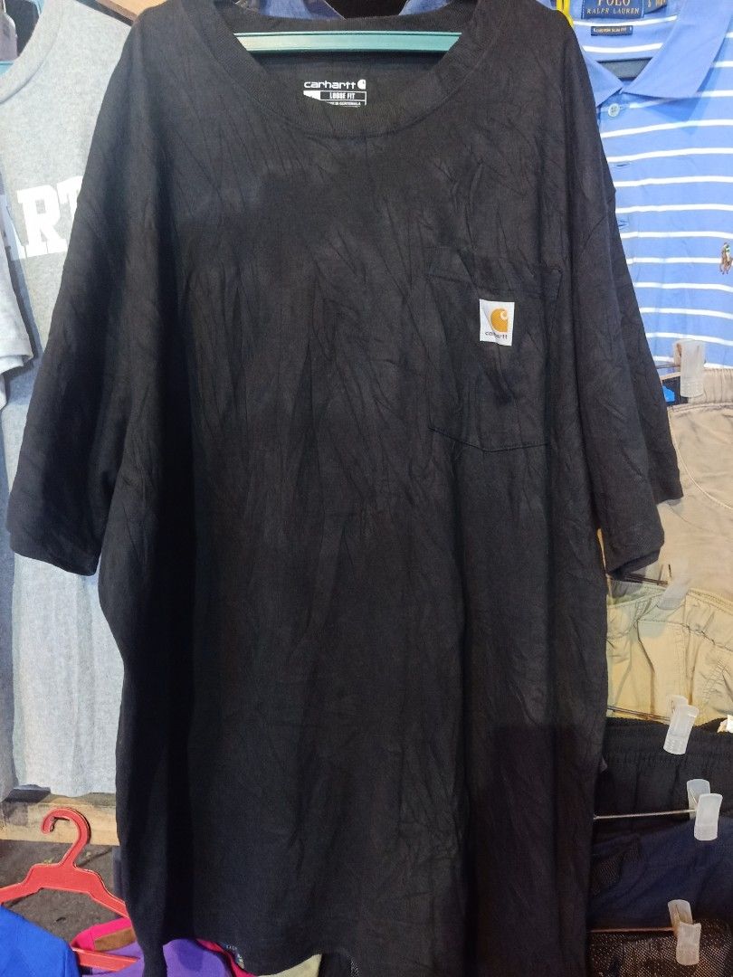 Carhartt T-Shirt Bundle - Black & Grey (Category: Tshirts & Polo Shirts ) located in Tagum. Submitted by tripthrift2026 (Listing ID 1458834968, Image 1). Description: - Bundle includes two Carhartt T-shirts. - Size: Large (L) - Color 1: Black with pocket and small logo. - Color 2: Grey with large 'CARHARTT' graphic on front. - Material: 100% Cotton - Perfect for casual and everyday wear..