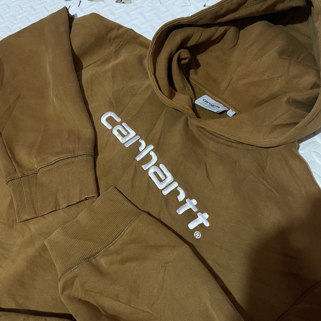 Carhartt Work In Progress Hooded Sweatshirt Brown Size L (Category: Coats, Jackets and Outerwear) located in Zamboanga. Submitted by selvege (Listing ID 1458710855, Image 3). Description: - Brown Carhartt hoodie - Size L - Embroidered Carhartt logo on front - Made from a comfortable cotton-polyester blend - Ideal for everyday casual wear - Please check photos for detailed condition.