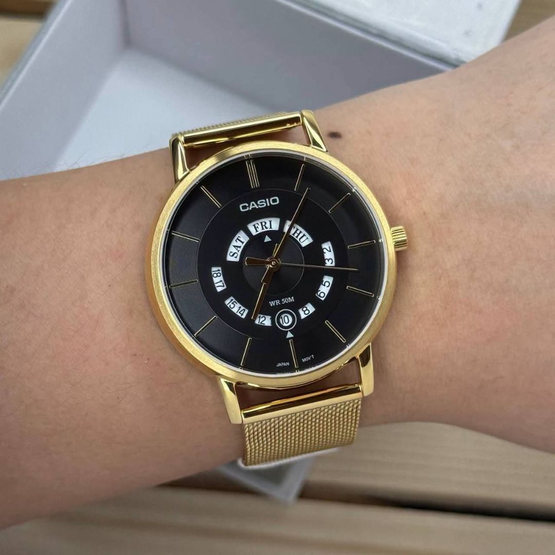 Casio MTP-B135M6-1AVDF Gold Mesh Watch (Category: Men's Watches) located in Caloocan City. Submitted by cha_essentials2026 (Listing ID 1458829770, Image 2). Description: - Gold Casio watch - Black dial - Day and date display - Adjustable mesh strap - Water resistant 50m - Includes original box - Perfect for daily wear or special occasions.
