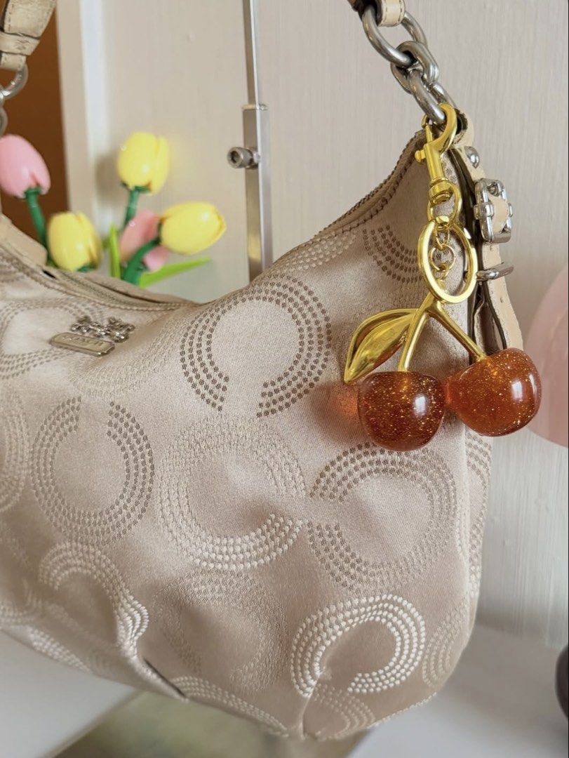 CCH Madison Dotted OP Art Kili Bag (Category: Luxury Bags & Wallets) located in Bulacan. Submitted by ar13lmariano (Listing ID 1458837911, Image 2). Description: CCH Madison Dotted OP Art Kili Bag *charms not included ° Condition: 9/10 (Rank A) • has signs of wear and usage, clean canvas, no visible major damage, intact strap. • very spacious interior, can fit a lot of things. • has small tear on zipper • silver hardware.