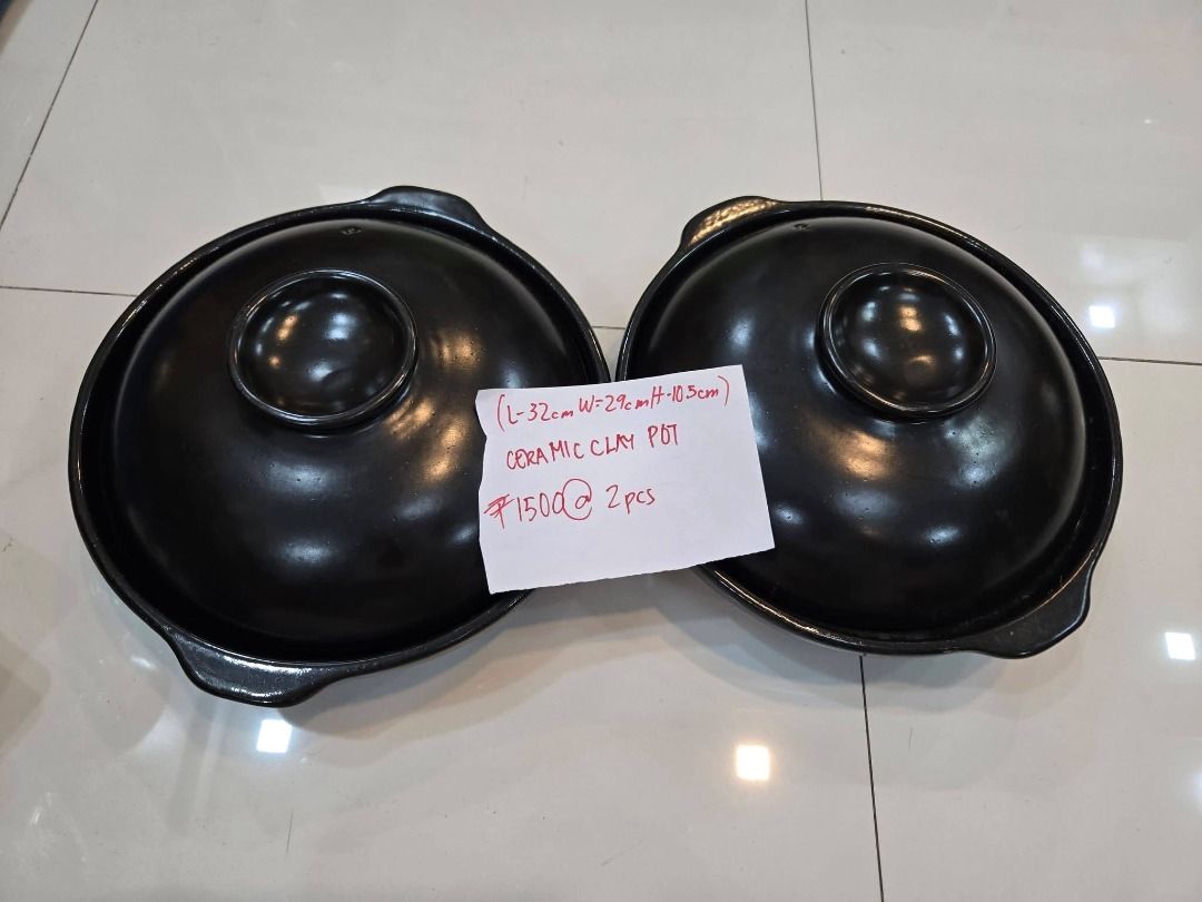 Ceramic Clay Pot (Category: Cookware & Accessories) located in Makati City. Submitted by maggayj98 (Listing ID 1458757959, Image 1). Description: - Set of 2 black ceramic clay pots - Dimensions: 32cm (Length) x 29cm (Width) x 10.5cm (Height) - Durable ceramic clay material - Classic black finish - Ideal for cooking stews, soups, and other dishes.