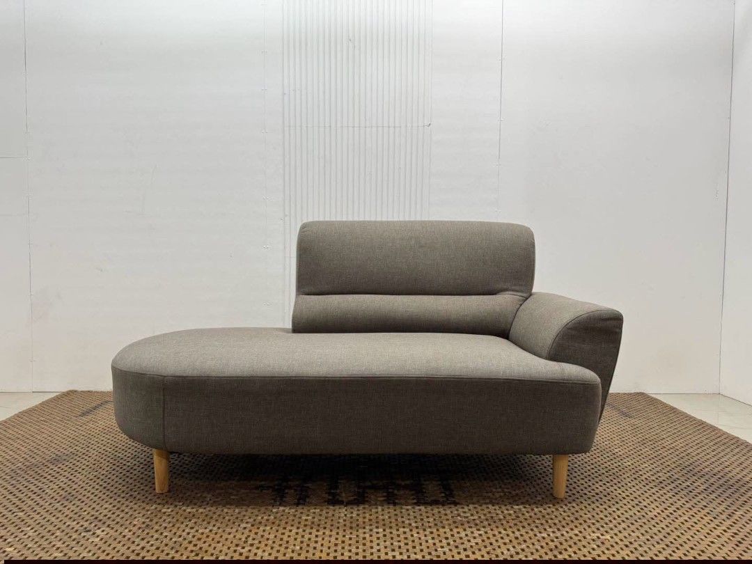 Chaise Lounged Sofa (Category: Sofas) located in Meycauayan. Submitted by marygracecasimiro (Listing ID 1458845397, Image 1). Description: Modern Curved Single-Arm Chaise Lounge Sofa Price: 13,900 L64 x W31.5 x H33/16 In good condition♥️ It has a wide lounging seat, one side armrest, integrated backrest, and tapered wooden legs, giving it a clean modern/Mid-Century look..