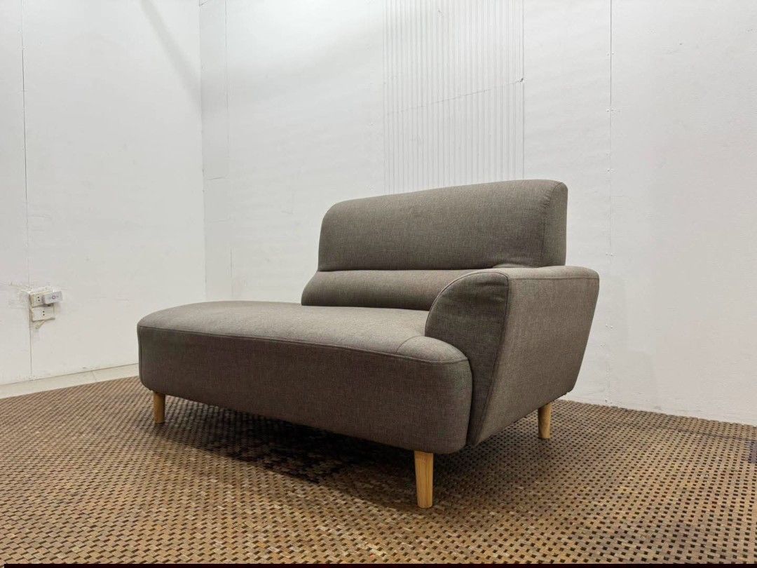 Chaise Lounged Sofa (Category: Sofas) located in Meycauayan. Submitted by marygracecasimiro (Listing ID 1458845397, Image 2). Description: Modern Curved Single-Arm Chaise Lounge Sofa Price: 13,900 L64 x W31.5 x H33/16 In good condition♥️ It has a wide lounging seat, one side armrest, integrated backrest, and tapered wooden legs, giving it a clean modern/Mid-Century look..