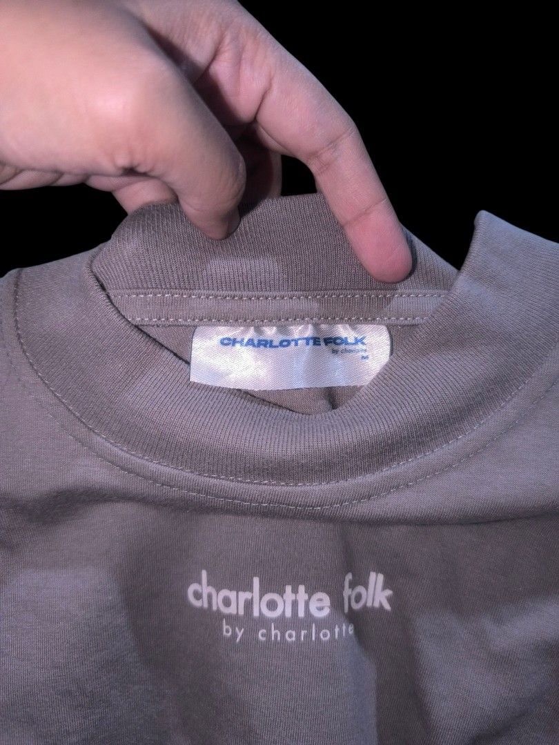Charlotte Folk Basic Tee SALE/SWAP (Category: Shirts) located in Muntinlupa City. Submitted by narymadine_ (Listing ID 1434870307, Image 2). Description: - Charlotte Folk Basic Tee - Size: M - Color: Gray - Regular Fit - Subtle Charlotte Folk logo - See size chart in photos.
