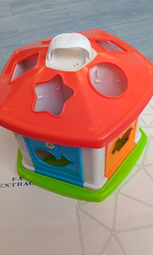CHICCO Baby House Toy (Category: Infant Playtime) located in General Trias. Submitted by aeunice (Listing ID 1458874077, Image 2). Description: Brand: Chicco In Good Condition. Vintage Chicco Gazebo Circus tent shape sorter toy. Each key unlocks a specific door and teaches shape recognition and enhances fine motor skills. Fun house-shaped sorter toy with colorful shapes to fit into holes. Easy to carry! Meet up / Shipping via Lalamove, JnT, Gogo 