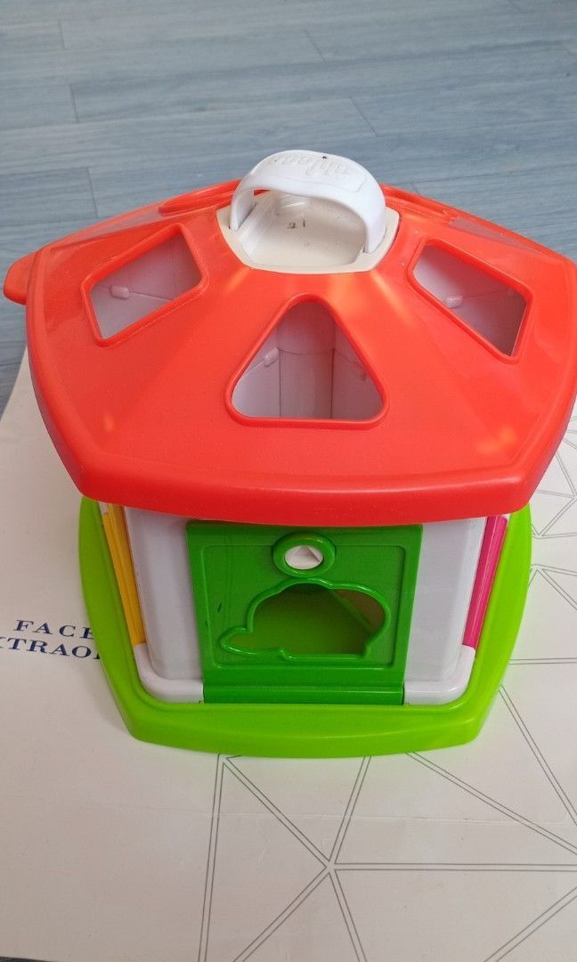 CHICCO Baby House Toy (Category: Infant Playtime) located in General Trias. Submitted by aeunice (Listing ID 1458874077, Image 1). Description: Brand: Chicco In Good Condition. Vintage Chicco Gazebo Circus tent shape sorter toy. Each key unlocks a specific door and teaches shape recognition and enhances fine motor skills. Fun house-shaped sorter toy with colorful shapes to fit into holes. Easy to carry! Meet up / Shipping via Lalamove, JnT, Gogo 