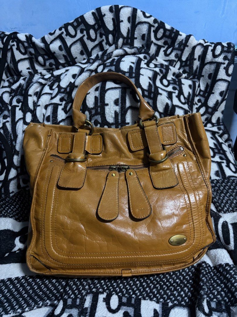 Chloe bay brown shoulder bag (Category: Luxury Bags & Wallets) located in Rizal. Submitted by ssbss (Listing ID 1458820216, Image 1). Description: Coded Chloe Bay Bag NGA | Check Photos One handle has repainted edge lining Water stain but it’s behind .