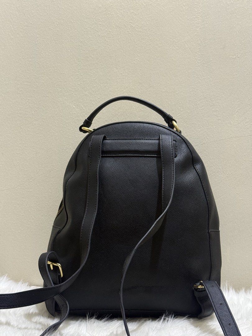 Coach Black Crossgrain Leather Medium Jordyn Backpack (Category: Backpacks) located in Quezon City. Submitted by clazzystudio (Listing ID 1458782773, Image 3). Description: Selling this stylish Coach Jordyn backpack crafted in durable black crossgrain leather with gold-tone hardware. Features the signature metallic Coach horse and carriage logo emblem, convenient front exterior zip pocket, long leather zipper pulls, top grab handle, and adjustabl