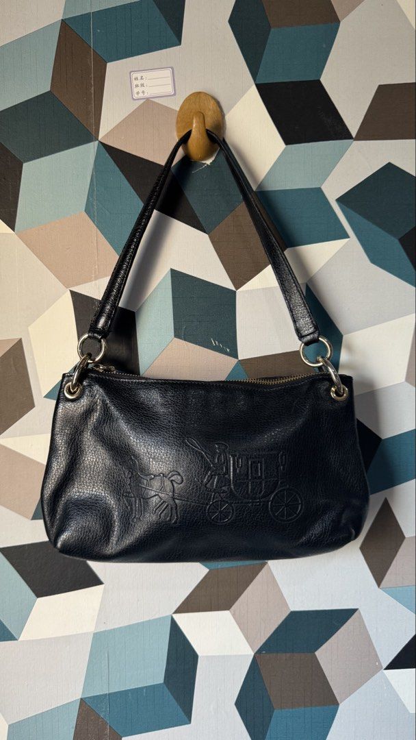 Coach Black Leather Shoulder Bag with Embossed Logo (Category: Luxury Bags & Wallets) located in Cebu City. Submitted by mochywony (Listing ID 1458882773, Image 1). Description: COACH black leather shoulder embossed horse and carriage P2100 FREE SF LAYAWAY OPTION: 30% dp, 3 weeks to pay (price is fixed) Price negotiable if full payment Guaranteed Authentic / Original Bag Condition: Rank AB - Great - no rubs, no cracks, no holes - Leather dryness 