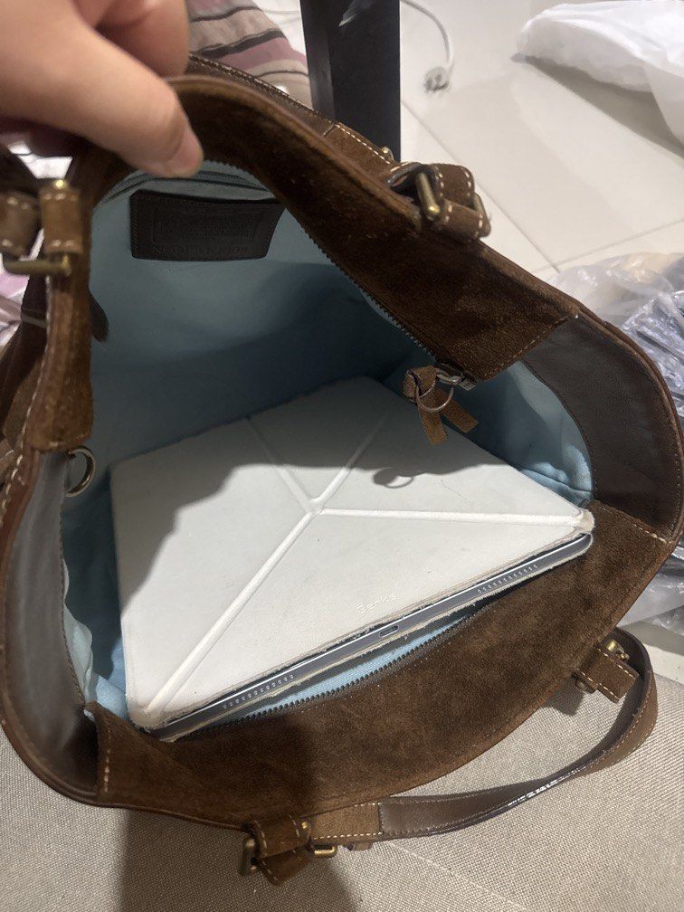 Coach Brown Suede Tote hand Bag (Category: Luxury Bags & Wallets) located in Taguig. Submitted by levinc (Listing ID 1437181492, Image 3). Description: - Coach brown suede tote bag - Dual top handles - Exterior side pockets - Leather trim - Includes Coach hangtag - Classic, structured design DM for more pics!.