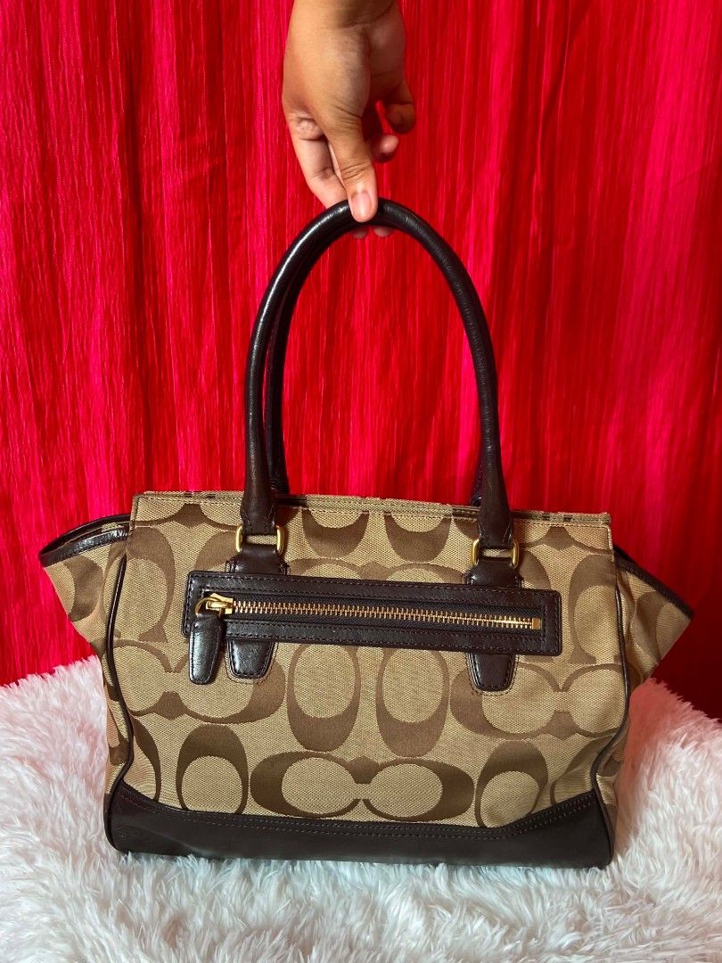 Coach Hamptons Signature Carryall (Category: Luxury Bags & Wallets) located in Bulacan. Submitted by bella.ken.varietystore (Listing ID 1458872951, Image 3). Description: Classic Coach monogram canvas tote with dark brown leather trim and handles. Zip top closure. Includes hangtag and tassel. Great everyday bag..