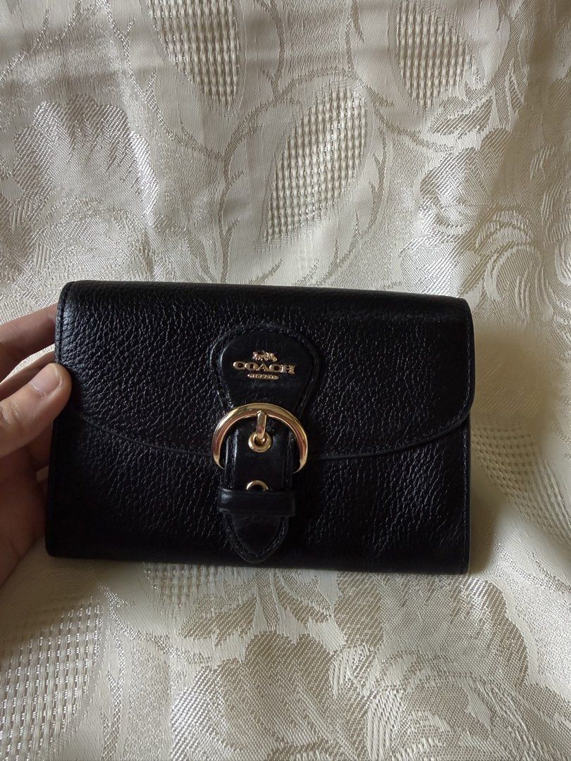 Coach kleo wallet (Category: Luxury Bags & Wallets) located in Rizal. Submitted by passingpieces (Listing ID 1458740827, Image 1). Description: - authentic coach - excellent condition - bought in japan - 4 card slots, coin slot - no issues Buyer will shoulder shipping fee Within Metro Manila: lalamove Outside of Metro Manila: J&T.