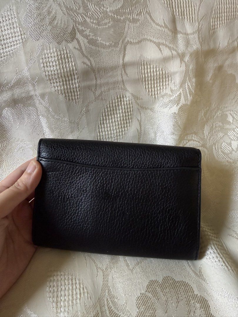 Coach kleo wallet (Category: Luxury Bags & Wallets) located in Rizal. Submitted by passingpieces (Listing ID 1458740827, Image 2). Description: - authentic coach - excellent condition - bought in japan - 4 card slots, coin slot - no issues Buyer will shoulder shipping fee Within Metro Manila: lalamove Outside of Metro Manila: J&T.
