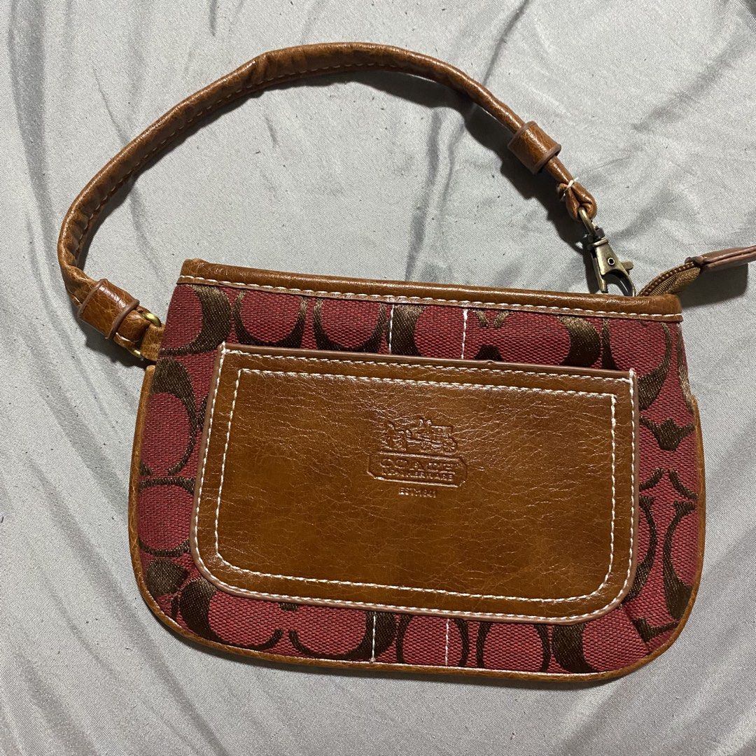 Coach Monogram Canvas and Leather Pouch Wristlet (Category: Luxury Bags & Wallets) located in Manila. Submitted by prelovedsellsss (Listing ID 1458771016, Image 1). Description: - Authentic Coach pouch - Classic red and brown C monogram pattern - Leather trim and wrist strap - Secure zipper closure - Interior zippered pocket - Small leather tag with Coach details - Ideal for carrying your essentials.