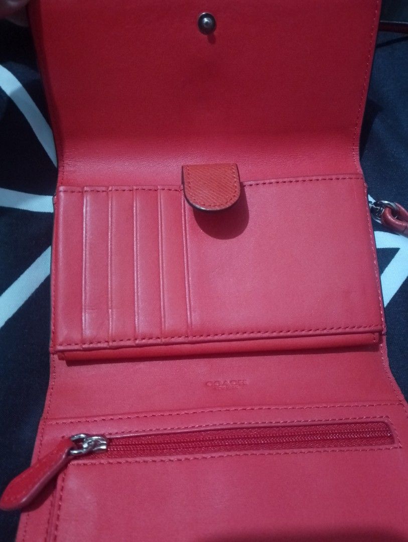 Coach Orange Leather Wallet on Chain Bag (Category: Luxury Bags & Wallets) located in Manila. Submitted by heart.09 (Listing ID 1458887512, Image 2). Description: -slight negotiable Orange leather Coach wallet on chain. Has multiple card slots inside and a zippered compartment. The strap is detachable. Perfect for carrying essentials..