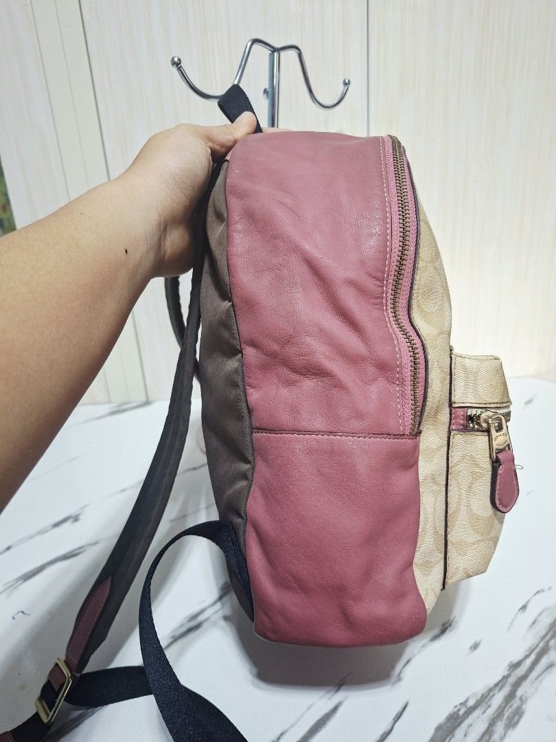 Coach Signature Canvas & Leather Backpack Pink (Category: Backpacks) located in Guimba. Submitted by imerlouberlykym (Listing ID 1458773457, Image 2). Description: - Authentic Coach backpack - Signature canvas with pink leather accents - Front zip pocket for easy access - Spacious main compartment - Adjustable straps for a comfortable fit - Proudly made in the Philippines - Shows some signs of wear (interior & exterior), please refer to pictures.