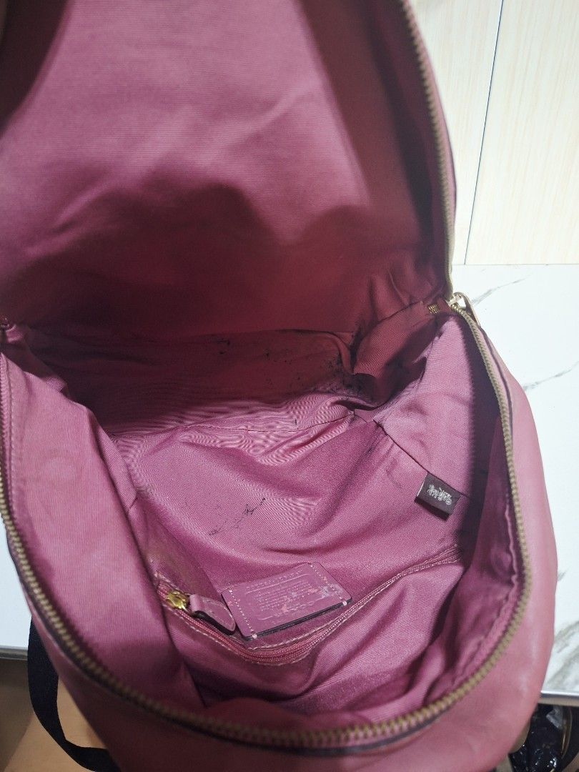Coach Signature Canvas & Leather Backpack Pink (Category: Backpacks) located in Guimba. Submitted by imerlouberlykym (Listing ID 1458773457, Image 3). Description: - Authentic Coach backpack - Signature canvas with pink leather accents - Front zip pocket for easy access - Spacious main compartment - Adjustable straps for a comfortable fit - Proudly made in the Philippines - Shows some signs of wear (interior & exterior), please refer to pictures.