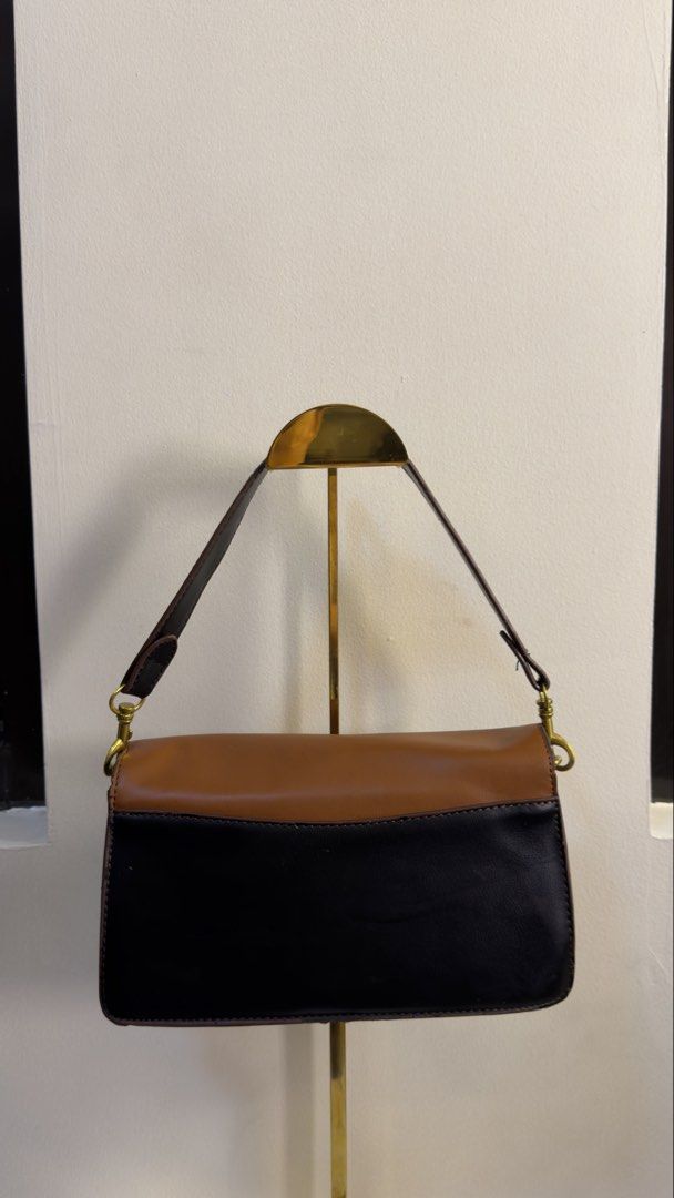 Coach Tabby shoulder and crossbody bag (Category: Cross-body Bags) located in Paranaque City. Submitted by preluxeshop_ph (Listing ID 1458792038, Image 3). Description: Coach Tabby shoulder and crossbody bag black and brown canvas texture Leather shoulder strap gold-tone hardware logo plaque foldover top magnetic fastening internal zip-fastening pocket Condition: GOOD. This previously owned and used item is in good condition with minimal signs of