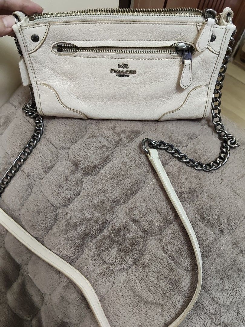 Coach White Leather Crossbody Bag with Chain Strap (Category: Cross-body Bags) located in Navotas City. Submitted by pereznahnah (Listing ID 1458758650, Image 3). Description: - Authentic Coach white leather crossbody bag - Textured leather finish - Silver-toned hardware - Stylish chain strap - Multiple zippered compartments for secure storage - Interior slip pockets for organization - Ideal for carrying daily essentials Made in the Philippines w