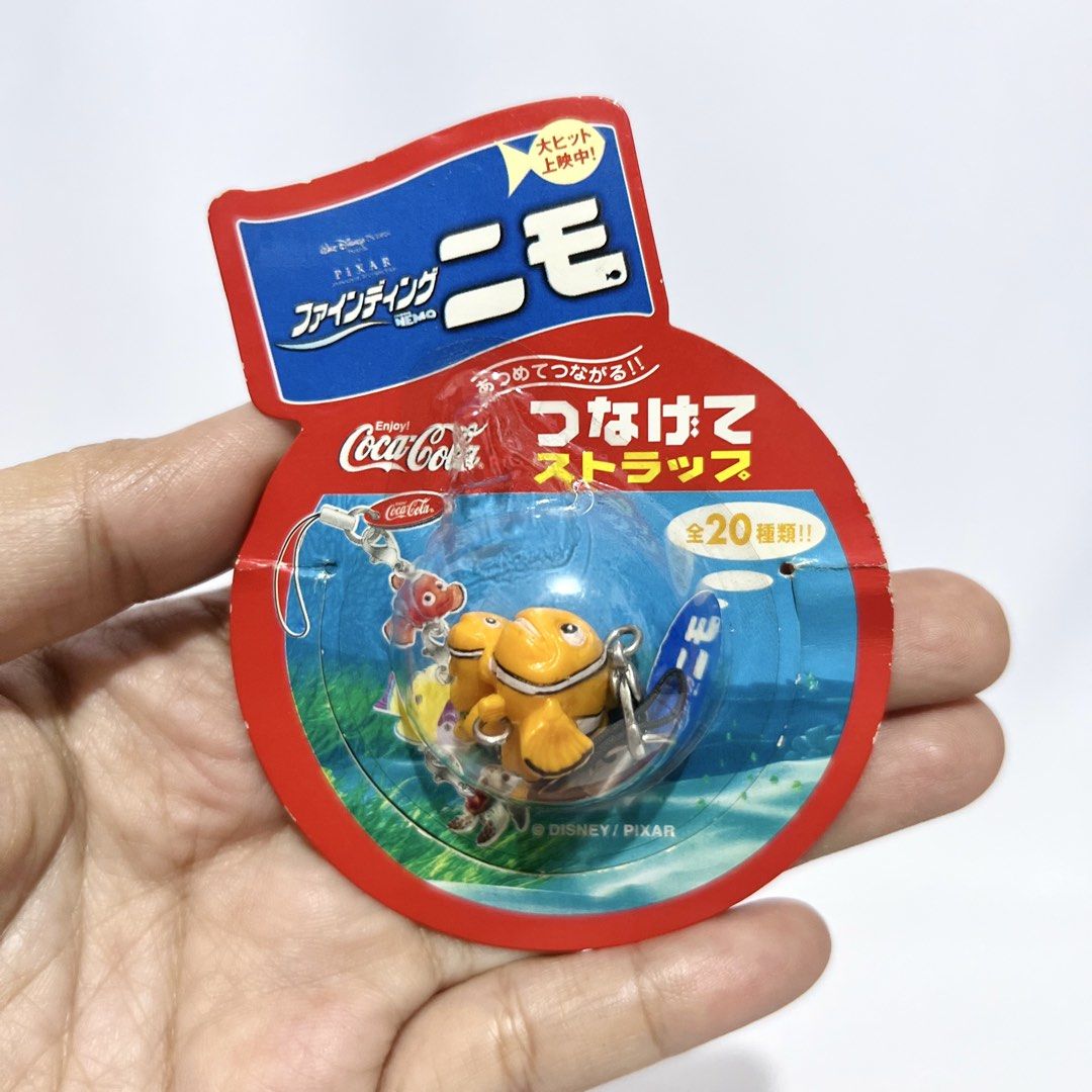 Coca-Cola x Finding Nemo Mini Figure Strap Charm - Php 100 (Category: Character Goods) located in Davao. Submitted by pandorastoybox (Listing ID 1458837615, Image 3). Description: Coca-Cola x Finding Nemo Mini Figure Strap Charm - Php 100.