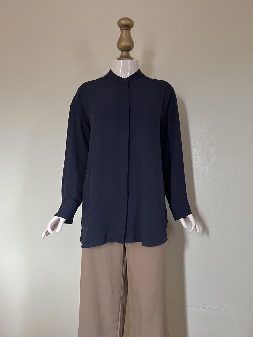 COS Navy Tie-front Blouse_ SALE (Category: Longsleeves) located in Subic. Submitted by miche.b (Listing ID 1458731619, Image 3). Description: 100% polyester mandarin style collar long sleeves with button cuffs concealed button-front closure adjustable tie-front detail relaxed fit slightly elongated fit curved hem.