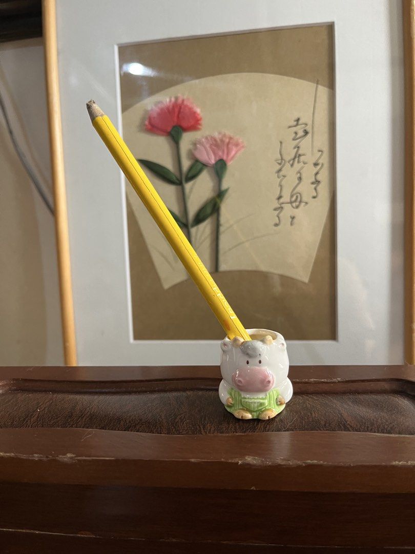 Cow Ceramic Holder (Category: Pots & Planters) located in Taguig. Submitted by minmin_parker (Listing ID 1458759835, Image 2). Description: - Adorable ceramic cow planter - Features green overalls - Ideal for small succulents or air plants - Adds a whimsical touch to desks and shelves - Makes a great gift for plant lovers or decor enthusiasts - Approximately 3 inches tall.