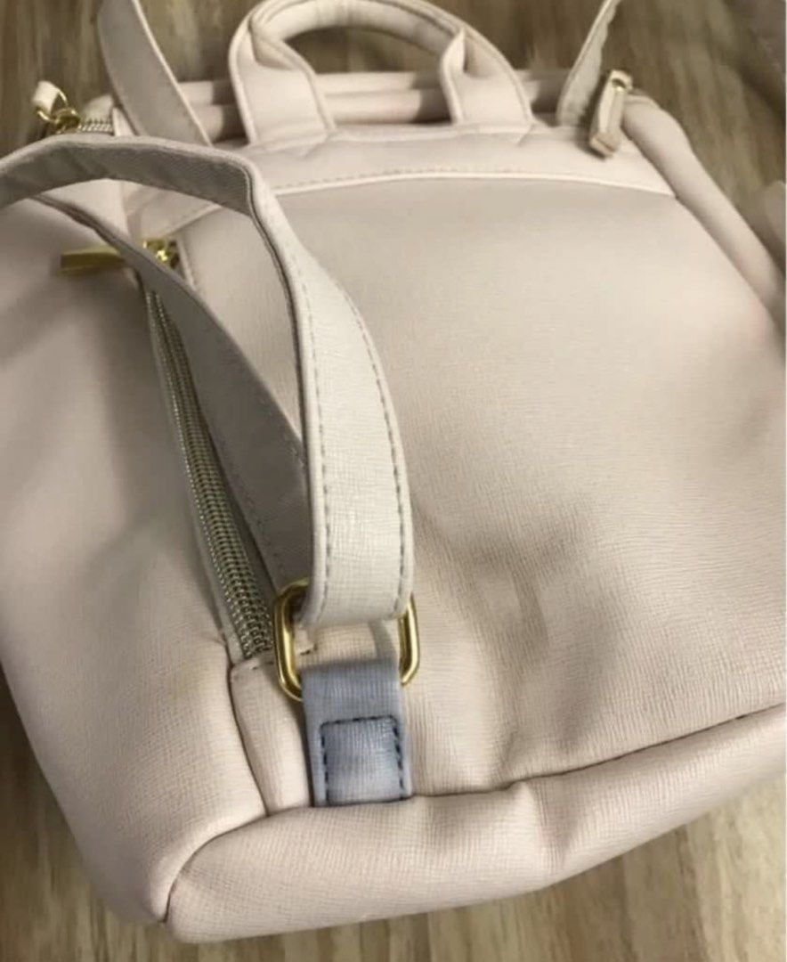 Cream backpack (Category: Cross-body Bags) located in Subang Jaya. Submitted by chocomintttt (Listing ID 1458709321, Image 3). Description: Defect shown in third picture. Not seen when worn as it is facing your back. Only buy if you don’t mind. Good quality bag that adds a boost of style. .