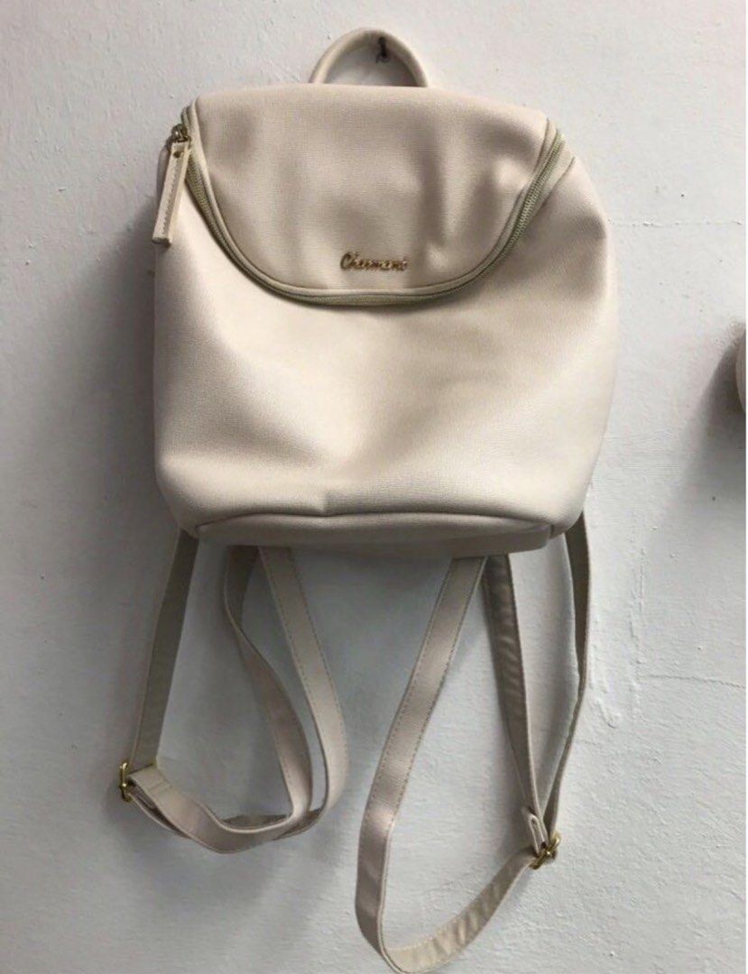 Cream backpack (Category: Cross-body Bags) located in Subang Jaya. Submitted by chocomintttt (Listing ID 1458709321, Image 1). Description: Defect shown in third picture. Not seen when worn as it is facing your back. Only buy if you don’t mind. Good quality bag that adds a boost of style. .