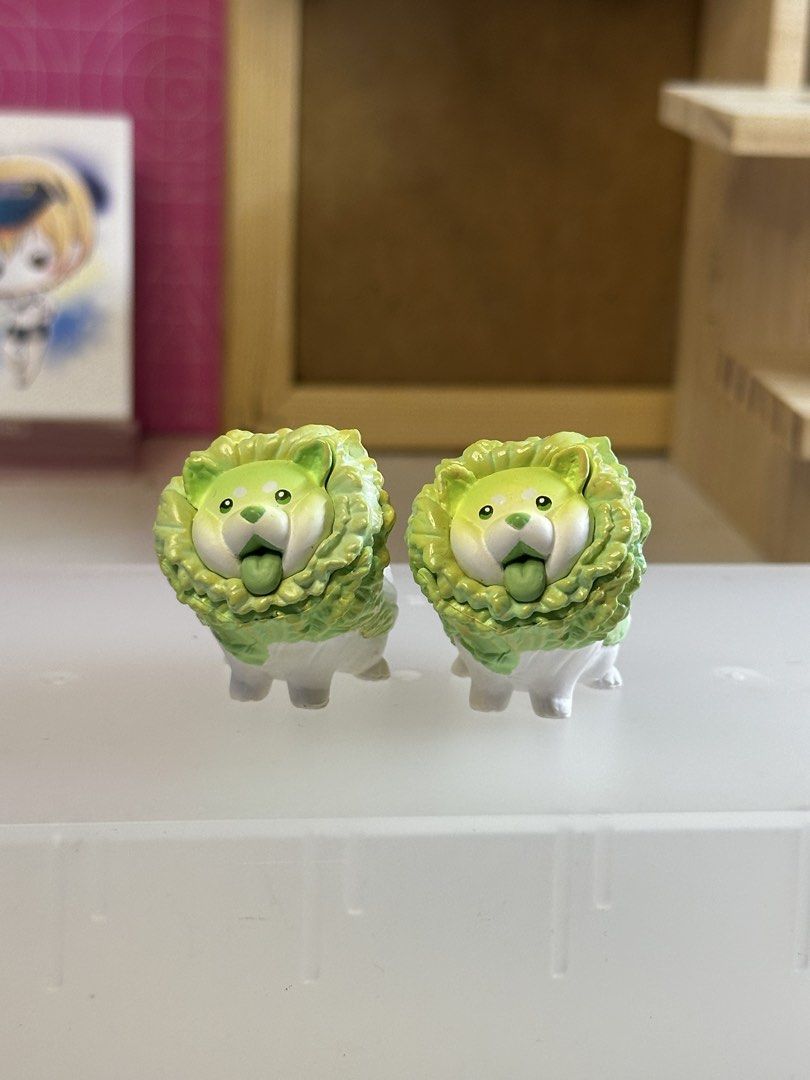 Cute Dog Vegetable Figurines sold per piece (Category: Other Home Decor) located in Pasig City. Submitted by mariel_candy (Listing ID 1458869776, Image 1). Description: Cute dog figurines resembling cabbage/lettuce. Small, collectible, and perfect for desk decor. Features Chinese characters on the bottom. Sold as a pair..
