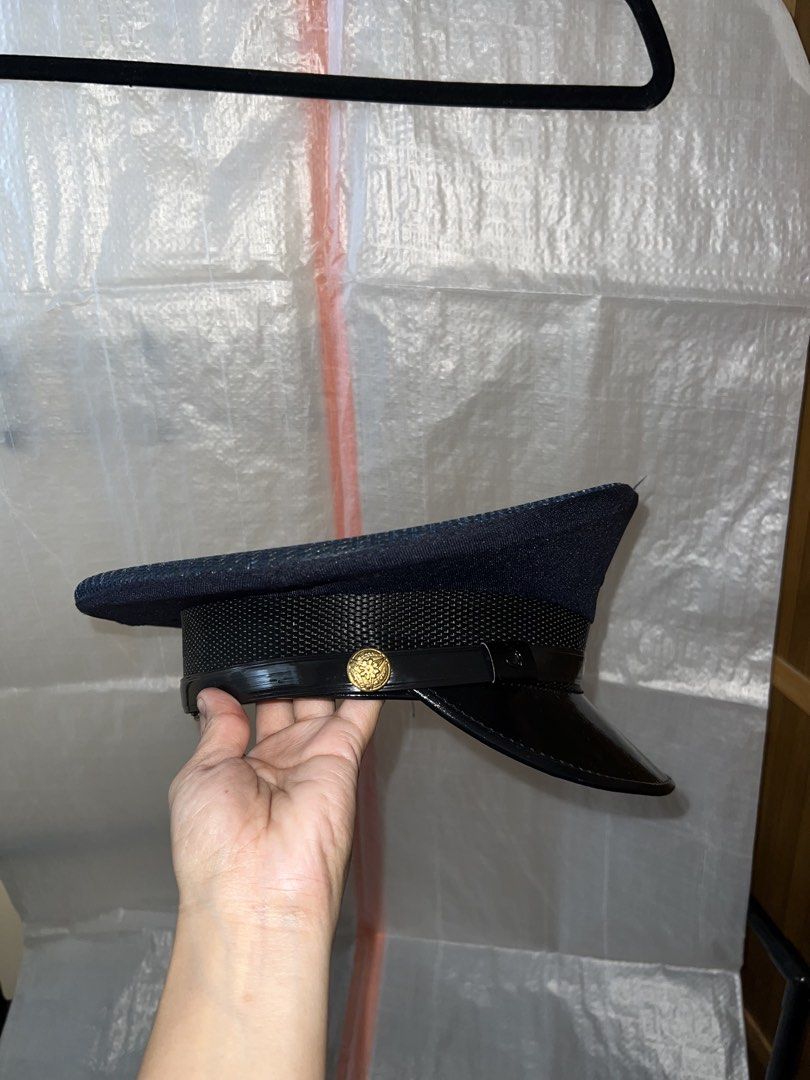 Dark Blue Security Guard Cap with Black Visor and Gold Button (Category: Caps & Hats) located in Manila. Submitted by chelseayb47224 (Listing ID 1458762177, Image 2). Description: - Dark blue Security Guard cap - Small - Used once for costume - High Quality purchased in official security personnel merchandise shop - Shiny black visor - Textured band around the base - Gold-colored button on the side - Lined interior with a mesh band - Ideal for co