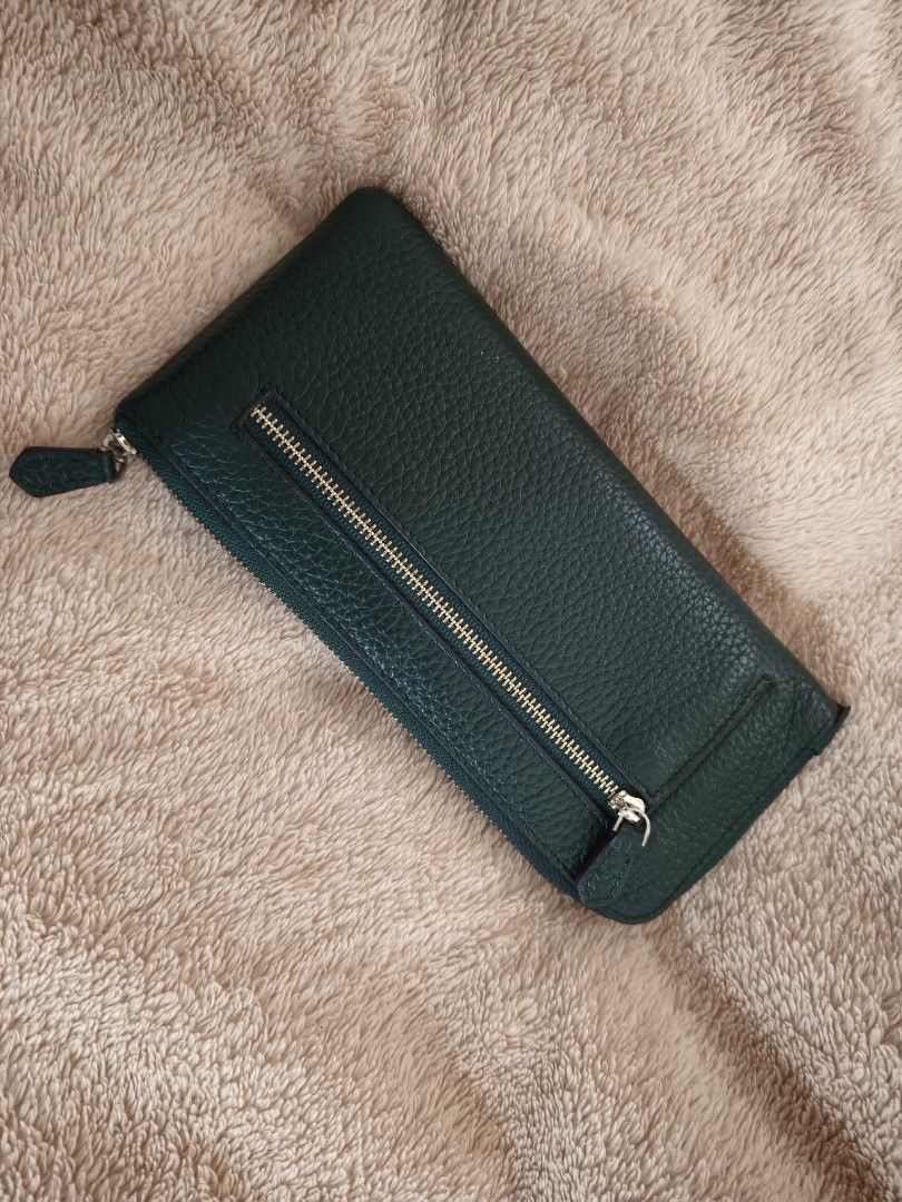 Dark Green Leather Zip Around Wallet (Category: Wallets & Card holders) located in Tanza. Submitted by declutterolshoppe (Listing ID 1458729947, Image 2). Description: - Classic dark green leather wallet - Textured leather finish - Zip-around closure (slight issue zipper) - Front zippered pocket - Multiple interior card slots and compartments - Gold-tone hardware.