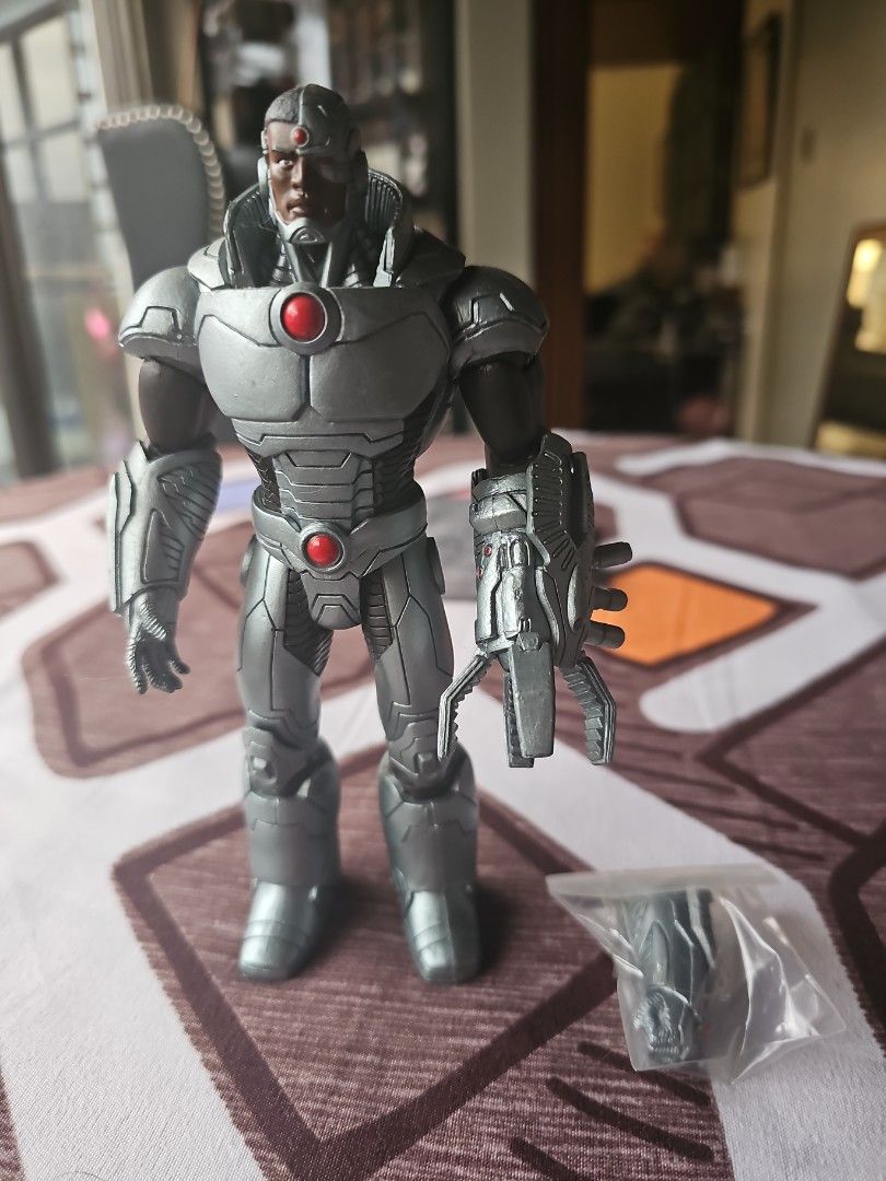 DC Comics Cyborg Action Figure (Category: Figurines & Statues) located in Angeles City. Submitted by ronaldbrillantes2012 (Listing ID 1458689711, Image 1). Description: - Detailed DC New 52 Cyborg action figure - Includes an extra accessory in a small bag - Poseable limbs for dynamic display - A must-have for any DC fan's collection.