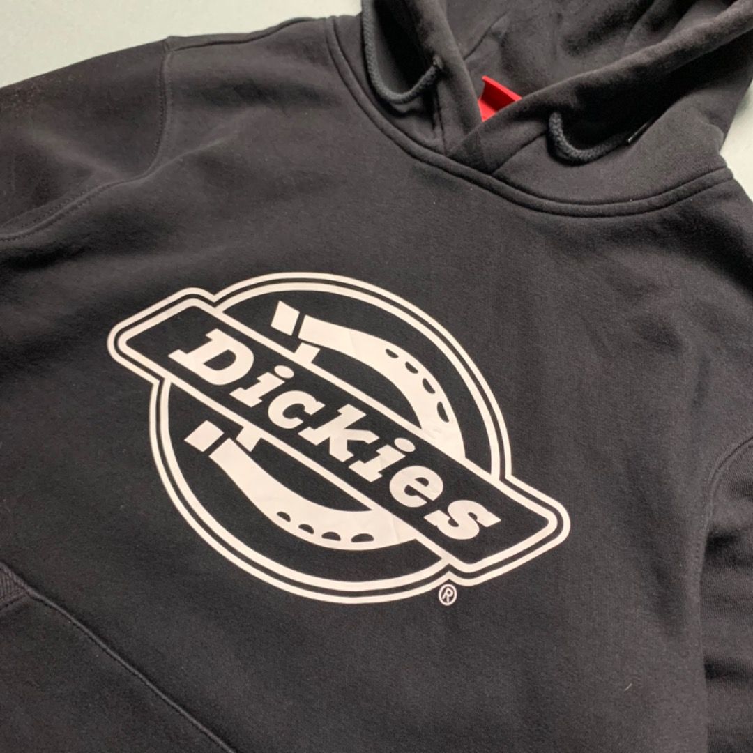 Dickies Circle Logo Pullover Hoodie - Black (Category: Coats, Jackets and Outerwear) located in Echague. Submitted by thrft_gllry (Listing ID 1458821574, Image 2). Description: Dickies Circle Logo Pullover Hoodie - Black Condition: Excellent Dimes(inches): L:25, W:19 Color rate: 10/10 Issue: None.