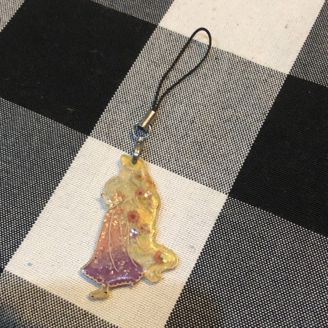 DISNEY RAPUNZEL MOBILE CHARM (Category: Other Mobile & Gadget Accessories) located in Quezon City. Submitted by kitsune.treasures (Listing ID 1458820756, Image 2). Description: *First to pay policy! *1 day reservation only. Failure to pay on time, auto cancel. 📍Quezon City * MOD: J&T | Lalamove * MOP: GCASH | BPI 📦ON HAND AND READY TO SHIP! CONDITION: WHAT YOU SEE IS WHAT YOU GET. Dimensions: Kindly check the photos for the actual measurements.