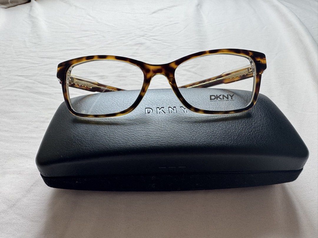 DKNY Tortoise Eyeglasses 53-17-140mm + Case (Category: Sunglasses & Eyewear) located in Manila. Submitted by yessikka (Listing ID 1458759891, Image 2). Description: The DKNY DY 4650 3533 is a full-rim women’s eyeglass frame featuring a transparent tortoise/brown crystal pattern and a cat-eye or wayfarer-style plastic/acetate build. Frame Specifications Brand: DKNY (Donna Karan New York) Model: DY 4650 Color Code: 3533 (Transparent Tortoise / Brow