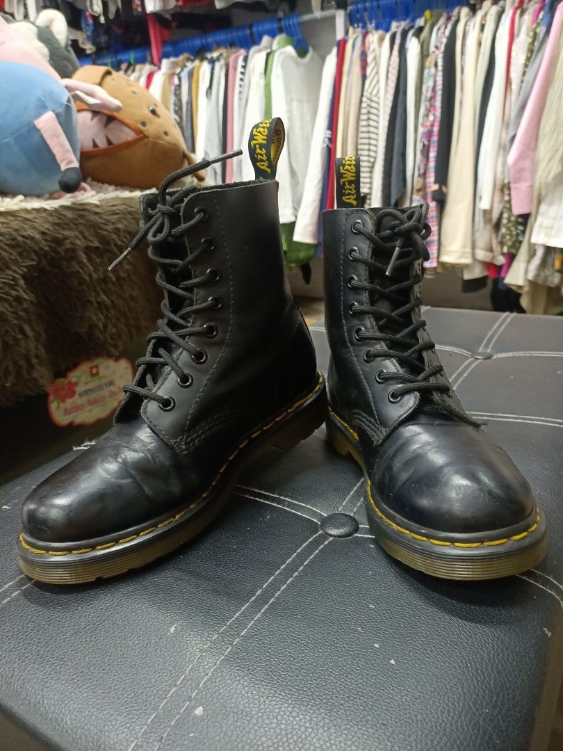 Dr. Martens Black Leather Lace-Up Boots (Category: Boots) located in Bayombong. Submitted by rheaaa00530 (Listing ID 1458826337, Image 1). Description: - Classic Dr. Martens boots - Black leather material - Lace-up style - Iconic yellow stitching on the sole - Versatile wardrobe staple.