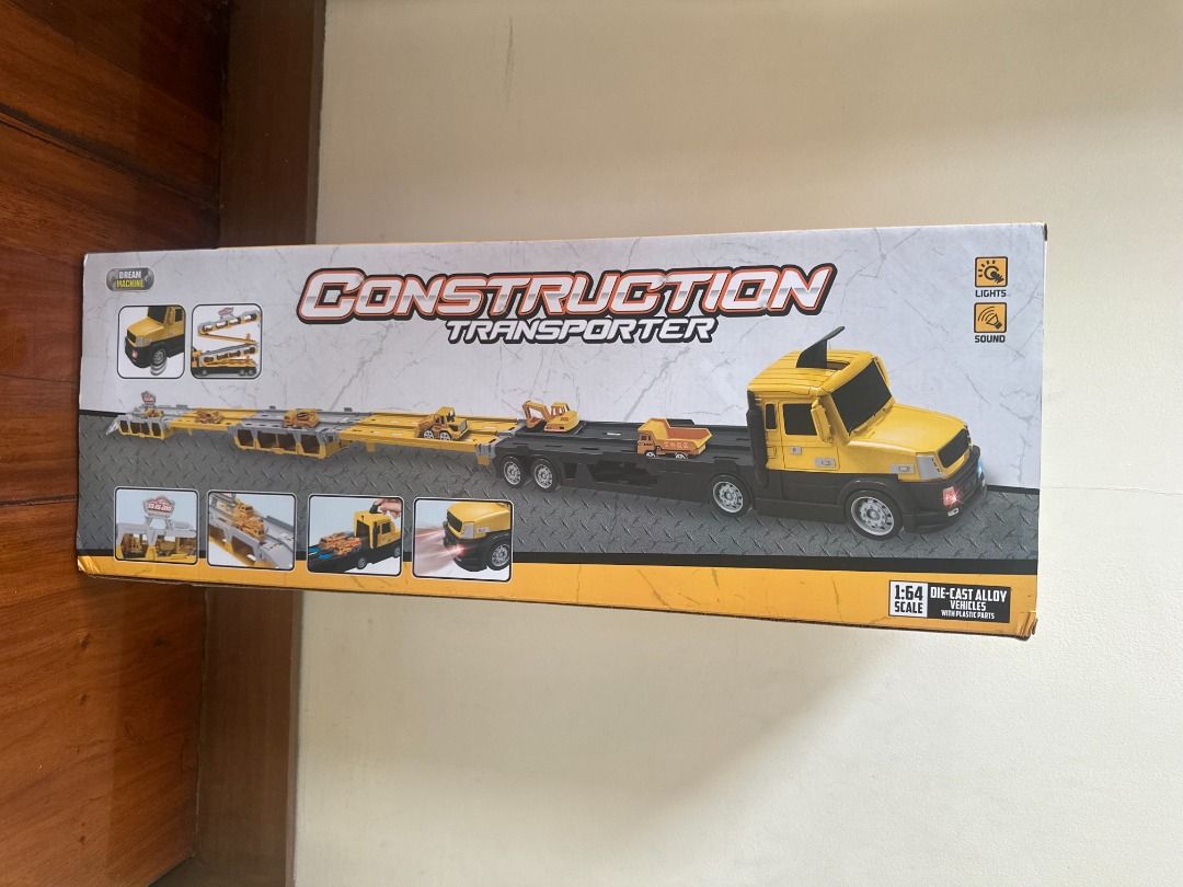 Dream Machine Construction Transporter Set (Category: Vehicle & Diecast Models) located in Makati City. Submitted by travelfinds34611 (Listing ID 1458744739, Image 2). Description: BRAND NEW. BOX NEVER OPENED. Dream Machine Construction Transporter Set - Yellow and black construction transporter toy - Includes 2 free-wheeling vehicles - Comes with traffic sign accessories - Ideal for kids who love construction play.