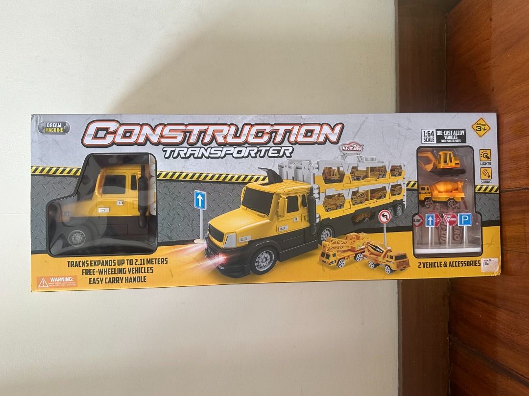 Dream Machine Construction Transporter Set (Category: Vehicle & Diecast Models) located in Makati City. Submitted by travelfinds34611 (Listing ID 1458744739, Image 1). Description: BRAND NEW. BOX NEVER OPENED. Dream Machine Construction Transporter Set - Yellow and black construction transporter toy - Includes 2 free-wheeling vehicles - Comes with traffic sign accessories - Ideal for kids who love construction play.