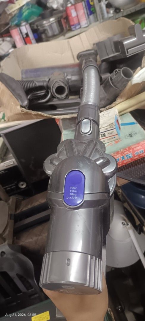 Dyson Cordless Vacuum Cleaner with Accessories (Category: Vacuum Cleaner & Housekeeping) located in Makati City. Submitted by livelion_c59905 (Listing ID 1458693283, Image 1). Description: - Dyson cordless vacuum cleaner - Includes various attachments for different cleaning needs - Powerful 'Max' setting for deep cleaning - 6-cell, 2000mAh, 45Wh battery pack - Dyson Japan website and contact number visible on unit - Ideal for quick and efficient 