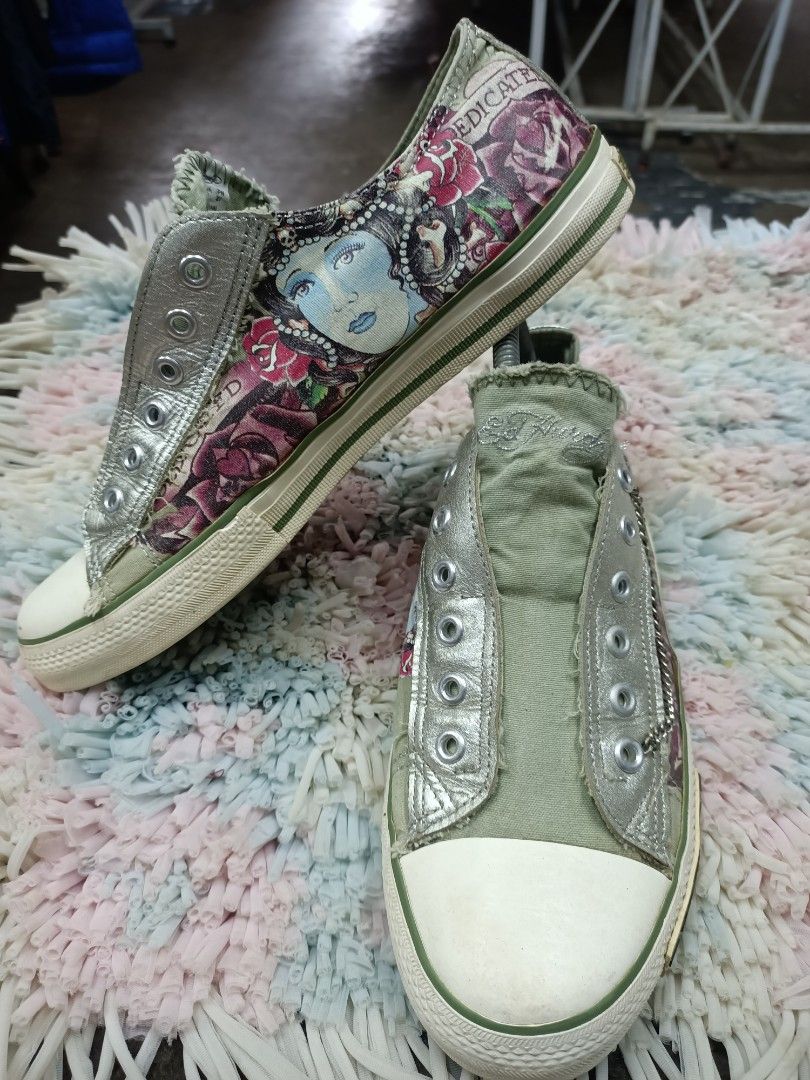 Ed Hardy Slip-On Sneakers - Size US 8 (Category: Sneakers) located in Bayombong. Submitted by rheaaa00530 (Listing ID 1458827122, Image 2). Description: - Ed Hardy slip-on sneakers - Features a tattoo-inspired print with roses and a woman - Green canvas with silver accents - Rubber sole with Ed Hardy logo - Easy slip-on style - Ideal for casual outfits.