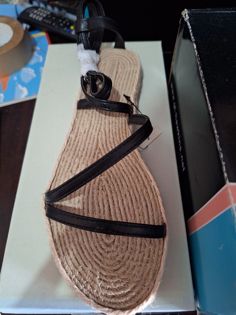 Espadrille Flat Sandals with Black Straps (Category: Flats & Sandals) located in Pasig City. Submitted by shopwithxandra (Listing ID 1458710407, Image 1). Description: - Shoopen from Korea 🇰🇷 - Flat espadrille sandals - Natural jute sole - Black faux leather straps - Ankle tie detail - Simple, chic, and comfortable for summer - Ideal for walking and everyday wear.