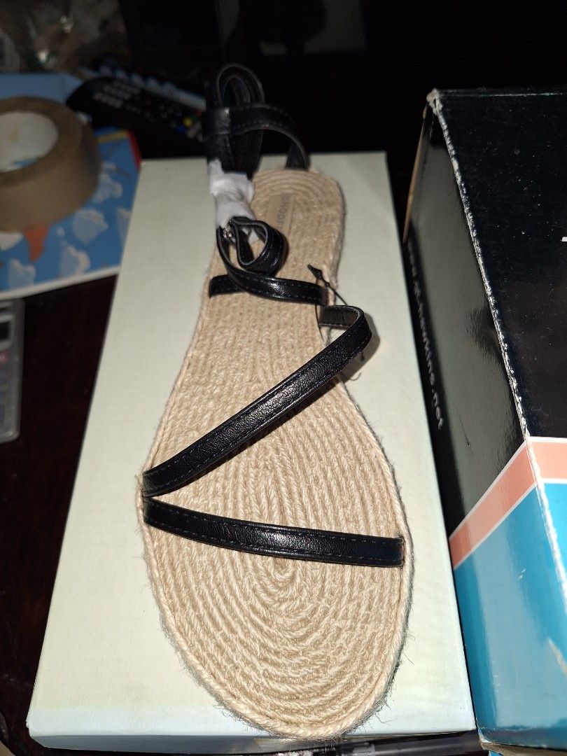 Espadrille Flat Sandals with Black Straps (Category: Flats & Sandals) located in Pasig City. Submitted by shopwithxandra (Listing ID 1458710407, Image 2). Description: - Shoopen from Korea 🇰🇷 - Flat espadrille sandals - Natural jute sole - Black faux leather straps - Ankle tie detail - Simple, chic, and comfortable for summer - Ideal for walking and everyday wear.