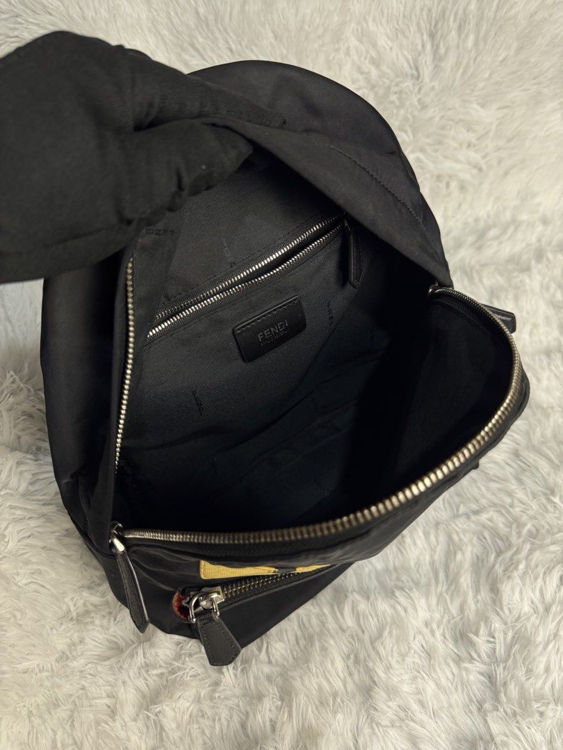 Fendi Black Nylon Monster Eyes Backpack (Category: Luxury Bags & Wallets) located in Villaverde. Submitted by theluxurythrift.ph (Listing ID 1458811507, Image 3). Description: Wts Fendi Backpack Size Small Rank AB Issue: Minimal Cracks on Both Eyes & Scratch 2999 + Sf.
